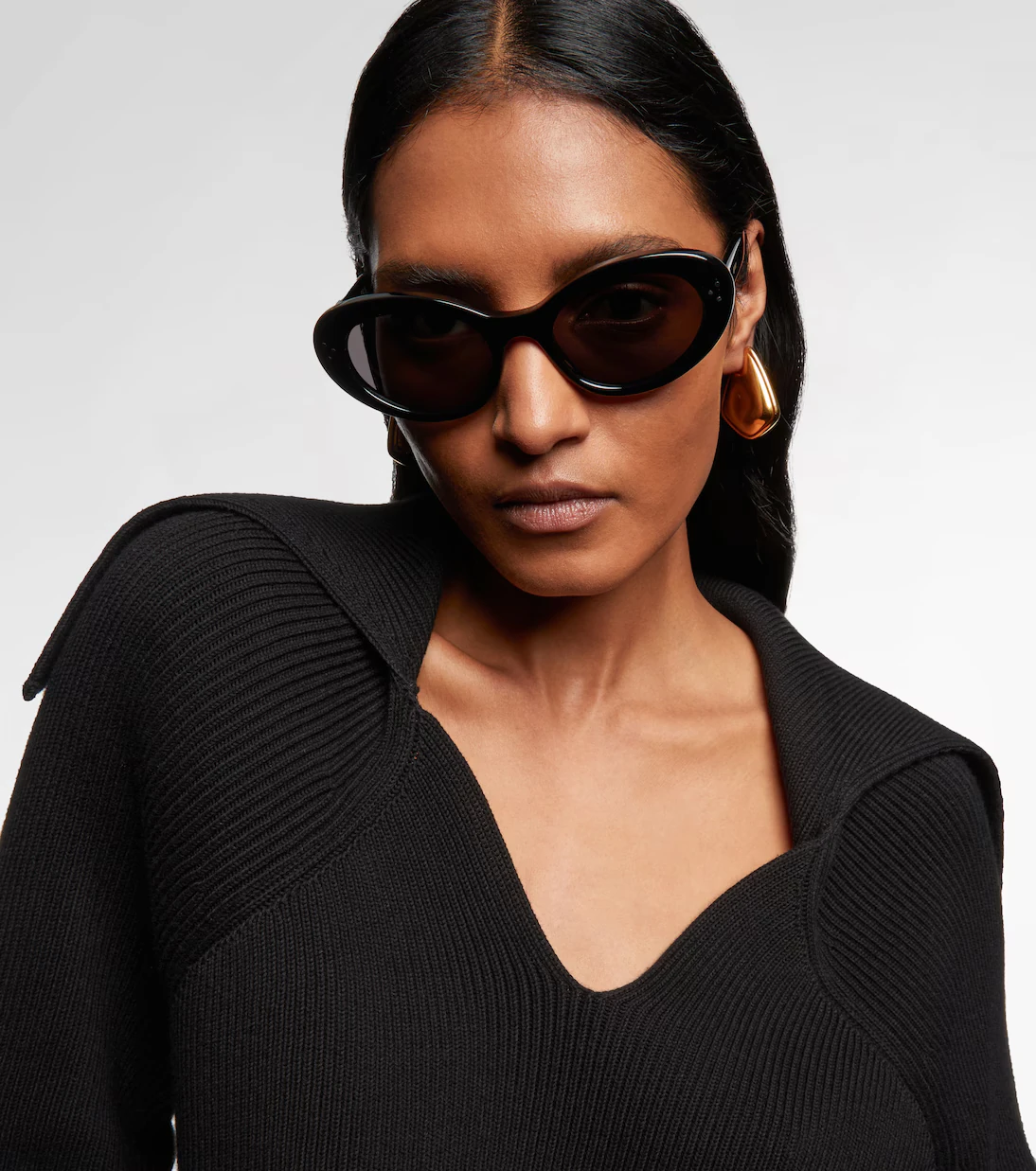 Female model wearing luxury Celine sunglasses.