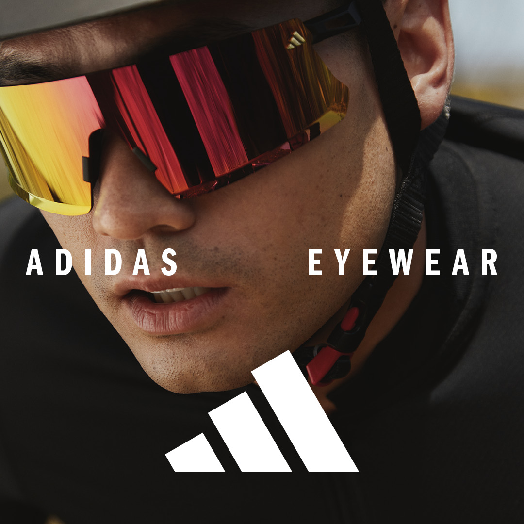 Male cyclist wearing Adidas sunglasses.
