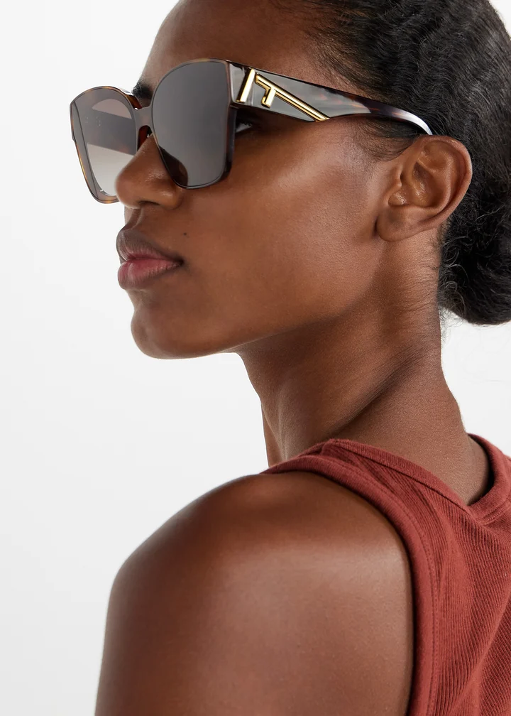 Female model wearing Fendi sunglasses.
