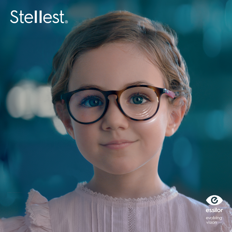 Child wearing glasses with Essilor Stellest lenses for myopia control