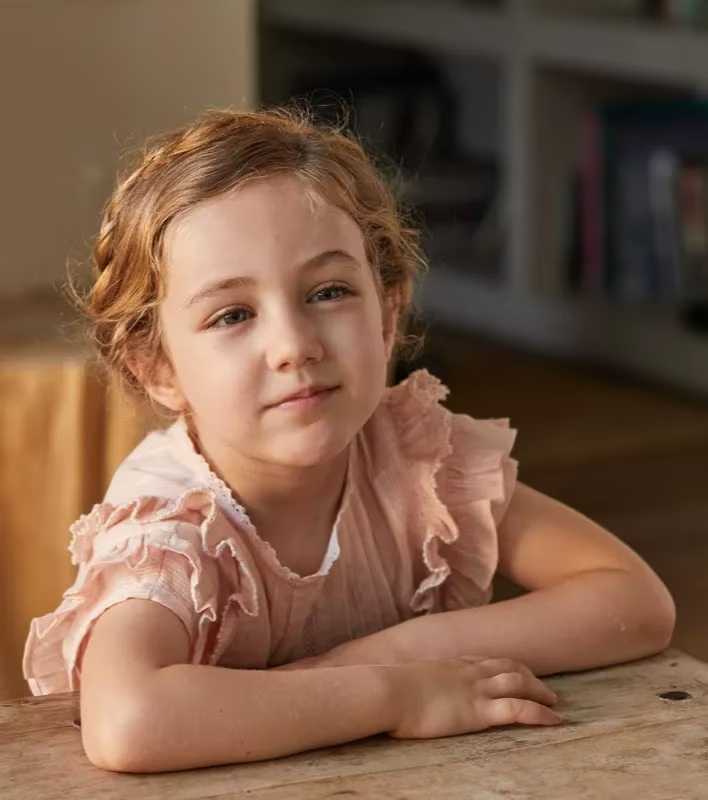Optometrist adjusting prescription glasses on a woman during a fitting at THE OPTICAL