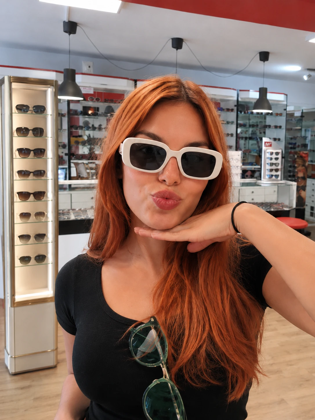 Customer posing with new sunglasses at THE OPTICAL